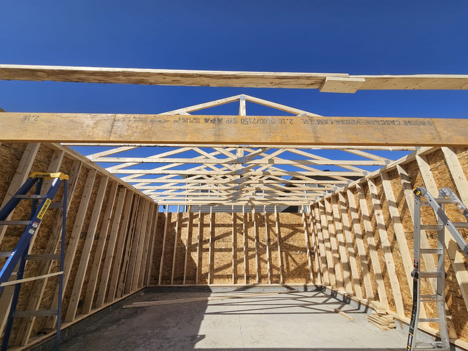 Interior wood framing with roof trusses, Calgary construction