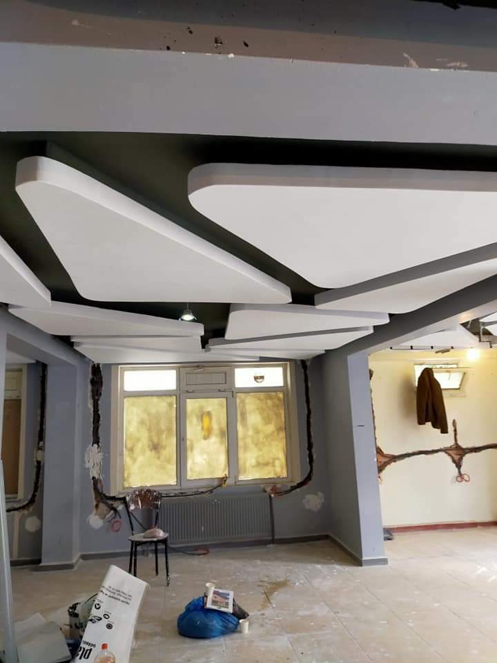 Living room with geometric ceiling after renovation, Calgary