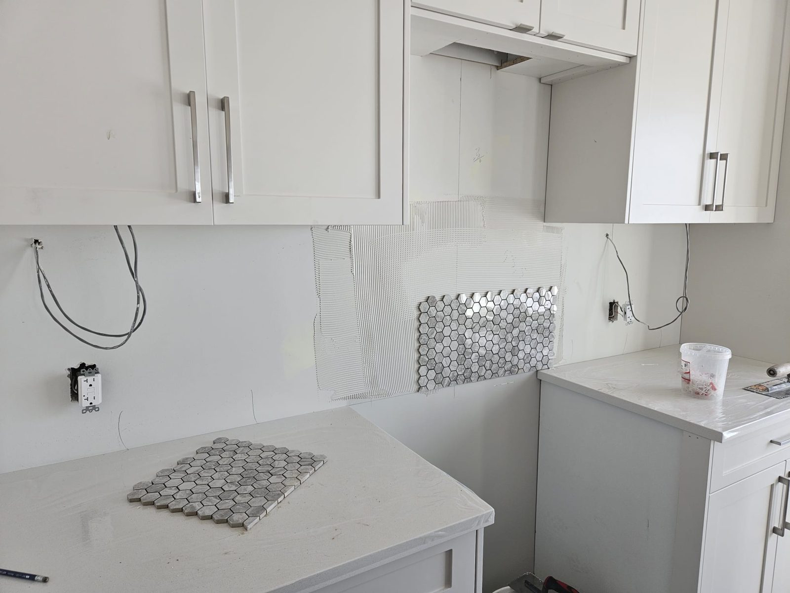 Kitchen under renovation, cabinets being installed